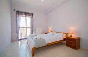 Ένα ή περισσότερα κρεβάτια σε δωμάτιο στο Valtaki Holiday Home