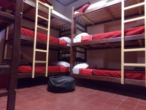 a room with four bunk beds in a room at Giramundo Hostel in Humahuaca