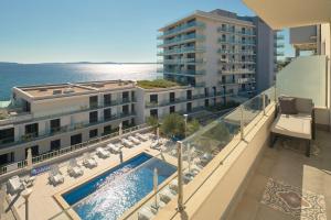 an aerial view of a hotel with a swimming pool at Klara Beach Apartment in Split