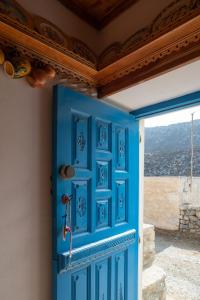 a blue door in a room with a view at Astahi 