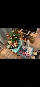 a room with a table with a potted plant on it at Studio le Monroe les pieds dans l'eau 10 m de la mer in La Seyne-sur-Mer