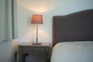 Кровать или кровати в номере La Citadelle Appartements