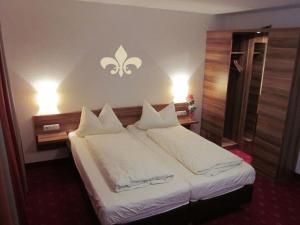 En eller flere senge i et værelse på Landgasthof & Hotel Jossatal