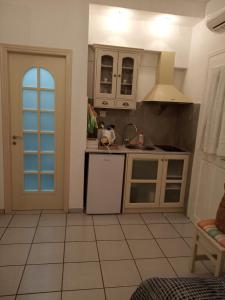 Kuchyň nebo kuchyňský kout v ubytování Giaglakis Rooms
