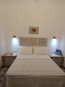 Postel nebo postele na pokoji v ubytování Giaglakis Rooms