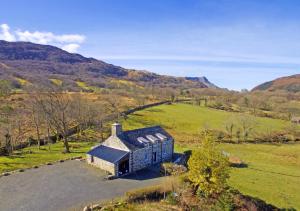 an aerial view of a house in a field at Penclogwynau in Dolgellau