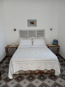 Postel nebo postele na pokoji v ubytování Giaglakis Rooms