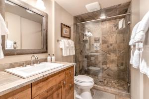 a bathroom with a shower and a sink and a toilet at Golf Creek 31 in Jackson