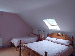 Postel nebo postele na pokoji v ubytování Foreen Lodge, Achill Island