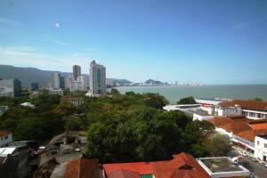 a city with a view of the water and buildings at Hotel Malaysia in George Town +27 photos
