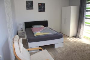 Postel nebo postele na pokoji v ubytování Ferienwohnung am Gilsbach