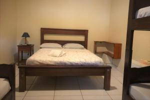 Postel nebo postele na pokoji v ubytování Geko Pousada Paraty