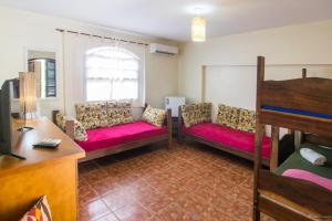 Postel nebo postele na pokoji v ubytování Geko Pousada Paraty