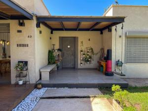 a front porch of a house with a door at חופשה בחורשה in Sha'al