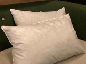 a white pillow sitting on top of a bed at Belken Hotel Kanda - Vacation STAY 80890v in Tokyo