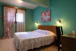 a bedroom with a large bed and a window at Vetrinos Apartments in Agios Nikolaos