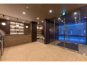 a lobby with a glass door in a building at Belken Hotel Kanda - Vacation STAY 80916v in Tokyo