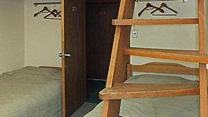 a small bedroom with a bunk bed and a closet at Zao Onsen Lodge Sukore - Vacation STAY 04418v in Yamagata