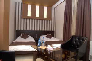 Voodi või voodid majutusasutuse Palma Palace Hotel toas