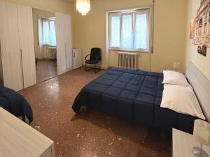 A bed or beds in a room at Palazzo Senesi