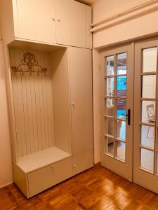 a room with a white cabinet and a door at Tar Pizza La Casa in Debrecen +42 photos