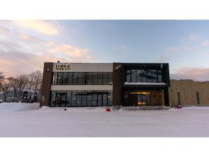 a building with a sign on the front of it at The Lodge Moiwa 834 - Vacation STAY 36158v in Niseko