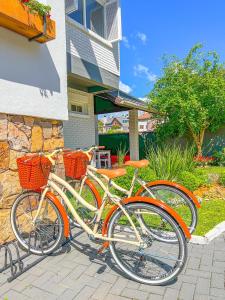 two bikes parked in front of a house at Flame Hotel Boutique Canela in Canela