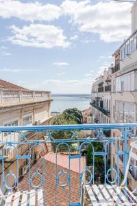 a balcony with a view of the water at Chiado 44 in Lisbon