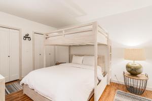 a bedroom with a bunk bed and a lamp at Golf Creek 16 in Teton Village