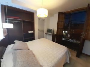 Ein Bett oder Betten in einem Zimmer der Unterkunft Coronado Hotel