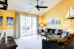 a living room with a couch and a table at Golf Retreat 832 in North Myrtle Beach