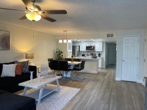 a living room with a couch and a table at LOVELY RENOVATED APARTMENT 3/2 CLOSE DISNEY in Kissimmee