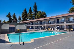 a swimming pool in front of a building at SureStay Hotel by Best Western Ukiah in Ukiah