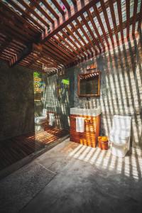 a bathroom with a sink and a toilet at Lush Atitl&aacute;n in San Marcos La Laguna