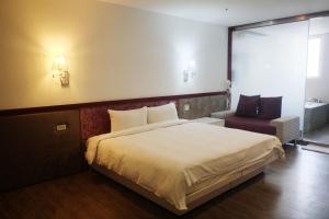 Postel nebo postele na pokoji v ubytování Walker Hotel - Zhengyi