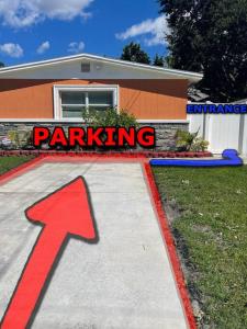 a ramp with a red arrow in front of a building at The Citrus Guesthouse in Tampa in Tampa