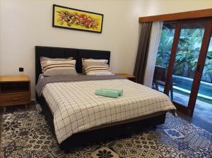 Postel nebo postele na pokoji v ubytování Villa HOMEY Lombok