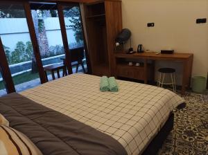 Postel nebo postele na pokoji v ubytování Villa HOMEY Lombok