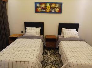 Postel nebo postele na pokoji v ubytování Villa HOMEY Lombok