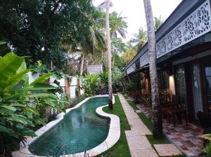 Bazén v ubytování Villa HOMEY Lombok nebo v jeho okolí
