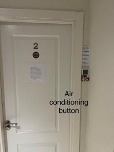 a door with an air conditioning button on it at Marbella Deluxe Rooms in Royal Cabopino Townhouse in Marbella