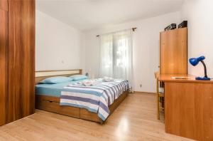 Ein Bett oder Betten in einem Zimmer der Unterkunft Apartment Milena