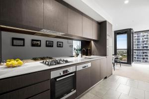 Kuchyň nebo kuchyňský kout v ubytování Luxuria Apartments - Fulton Lane