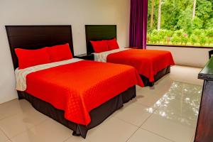 Postel nebo postele na pokoji v ubytování Hotel Los Rios