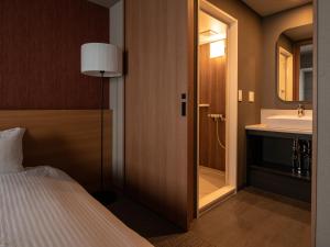 Letto o letti in una camera di MIMARU SUITES Tokyo Asakusa
