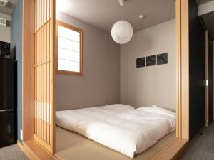 Letto o letti in una camera di MIMARU SUITES Tokyo Asakusa