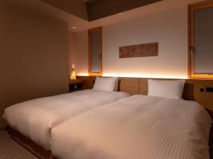 Letto o letti in una camera di MIMARU SUITES Tokyo Asakusa
