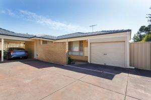 a house with a car parked in front of it at Living on Lennard - Pet friendly house close to CBD in Perth