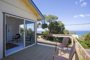 a balcony with chairs and a view of the ocean at Salamanca in Lorne