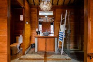a bathroom with a sink and a toilet at Turtle Villas, Canggu by Manara in Canggu +33 photos